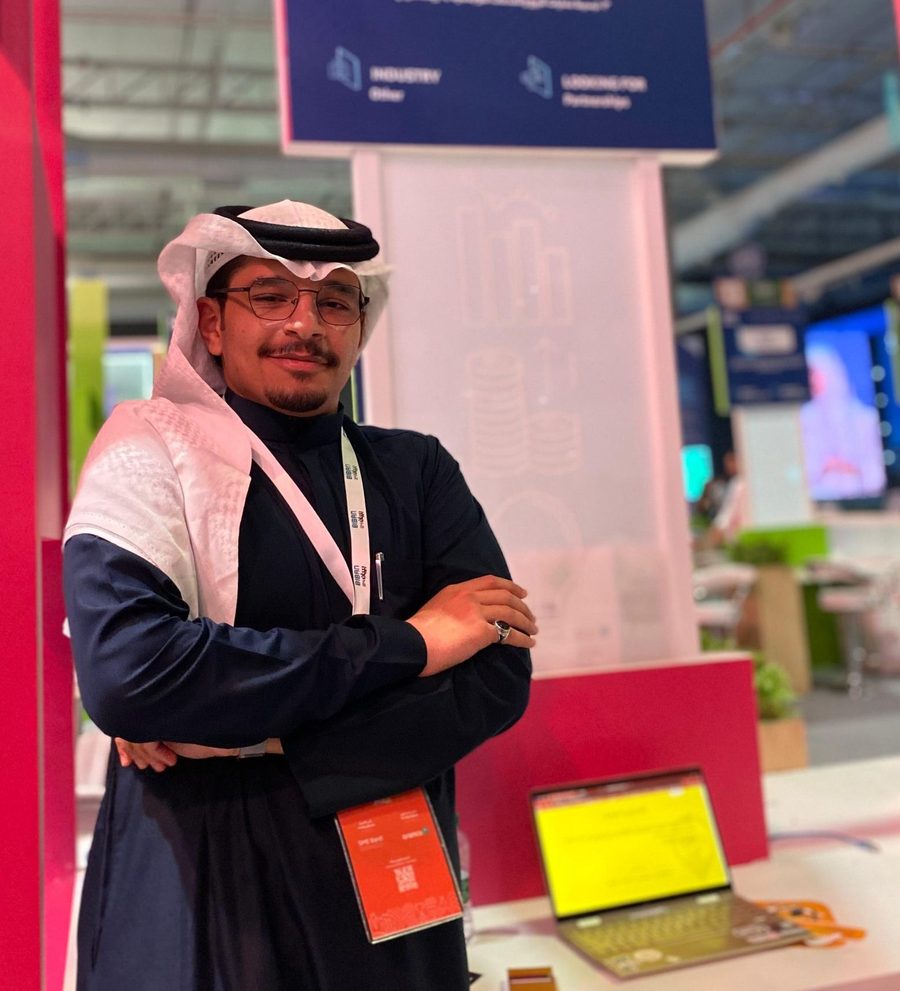 Abdulrahman Algethami standing at an exhibition stand